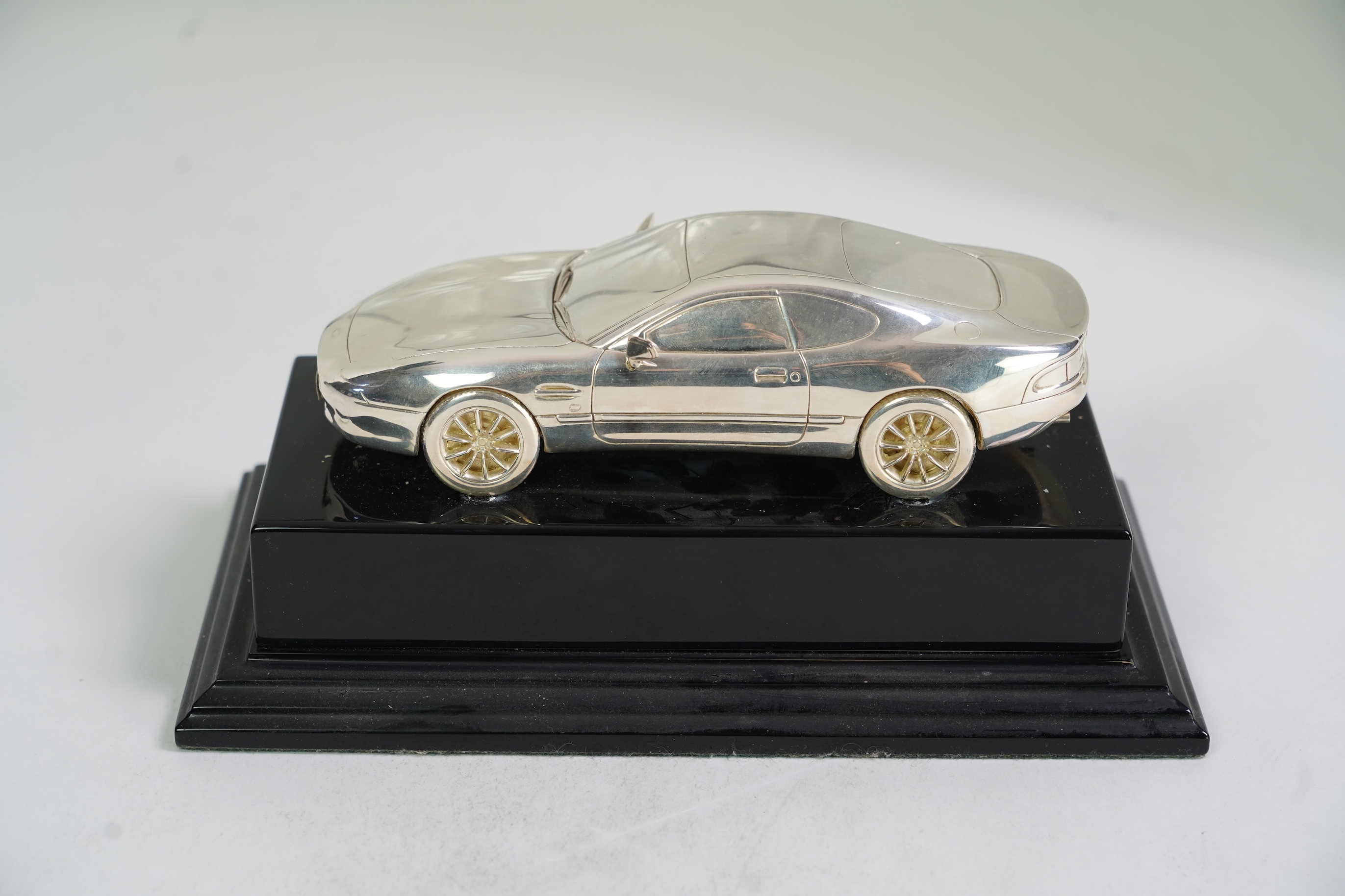 An Elizabeth II miniature silver model of an Aston Martin DB7 Vantage, by Aston Martin Lagonda Design Ltd